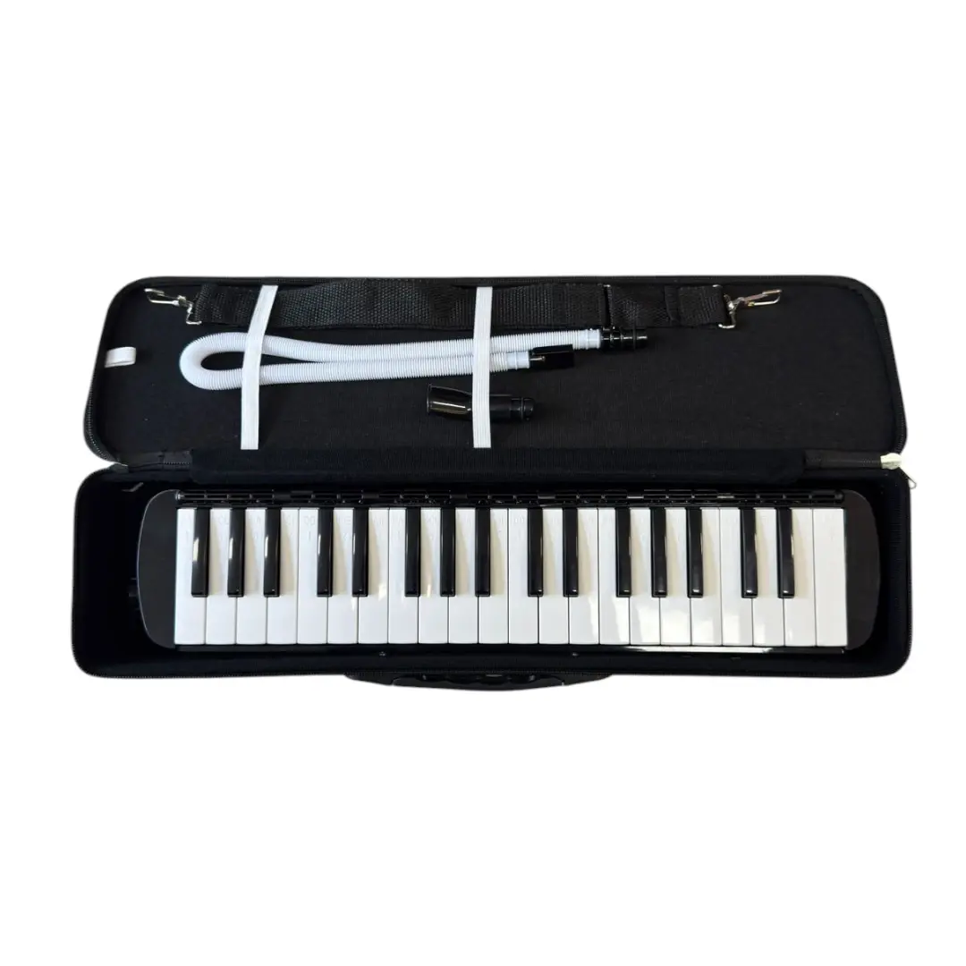Melodica color NEGRO con estuche, boquilla y manguera distribuido por musicales el clarin